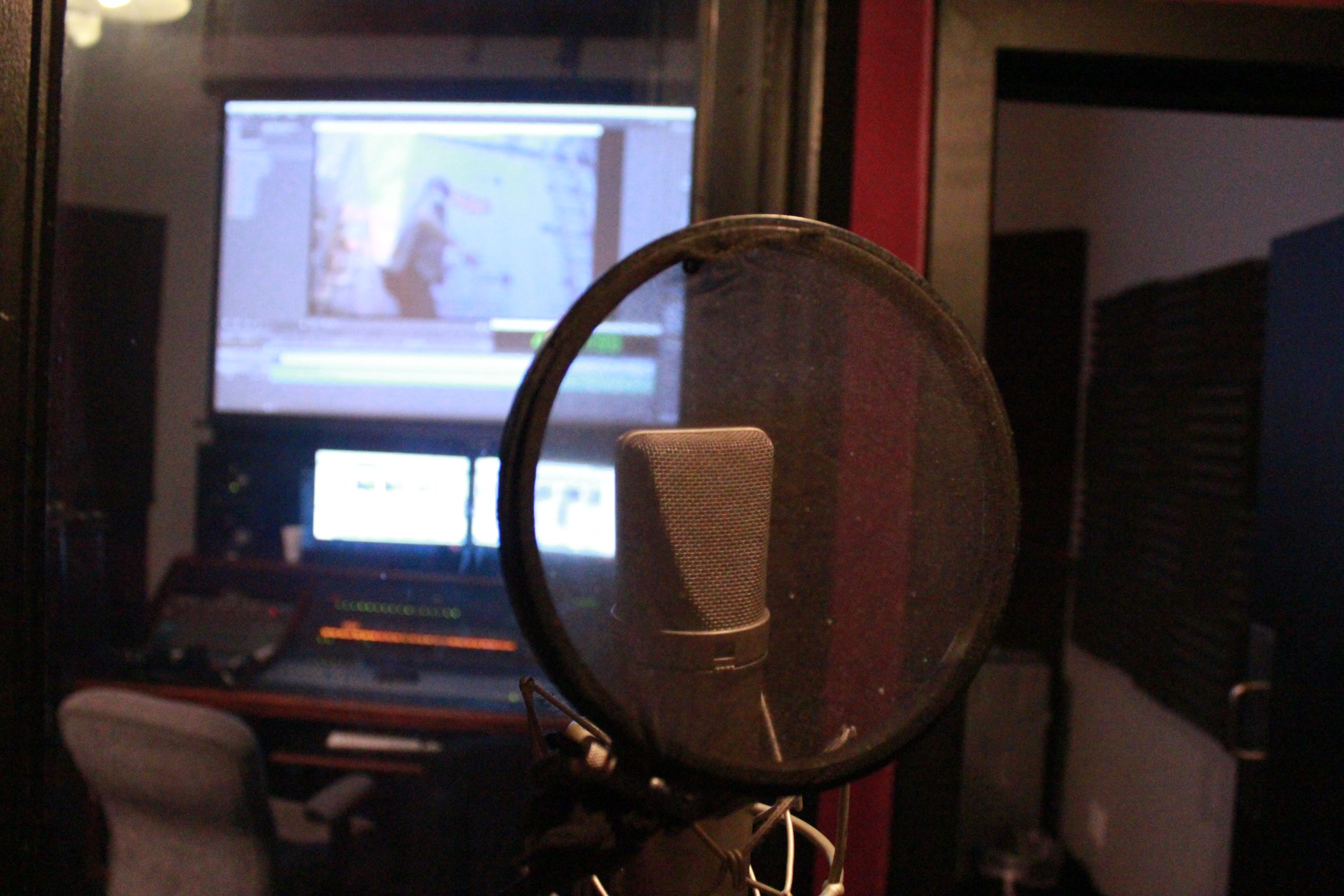 Studio microphone and pop filter inside a TallCat vocal booth
